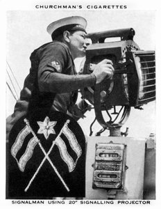 Signalman using 20 Signaling Projector, 1937.