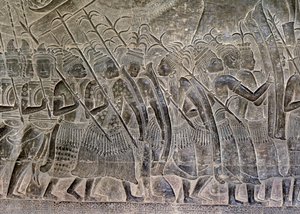 Angkor Wat, Angkor, Kambodža Počátek 12. století s pozdějšími doplňky. Tento detail reliéfů v galerii ukazuje THAJSKÝ lid pochodující jako spojence khmerské armády