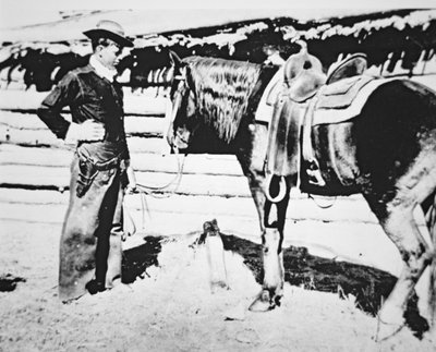Butch Cassidy (1866-1908/09) se svým koněm (černobílá fotografie) od American Photographer