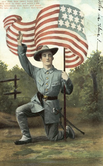 Americký voják držící hvězdy a pruhy (barevné foto) od American School