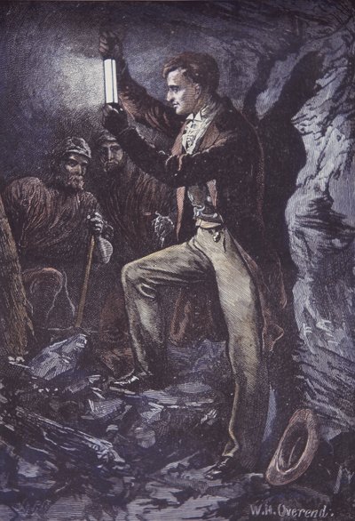 Humphry Davy s bezpečnostní lampou Davy pro horníky, vynalezená v roce 1815 (ručně kolorovaná dřevorytina) od British School