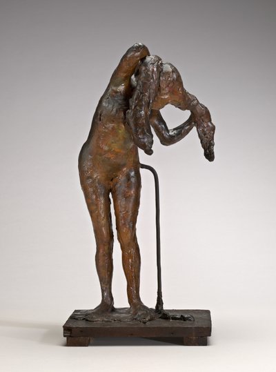 Žena si upravuje vlasy, možná koncem 80. let 19. století. od Edgar Degas