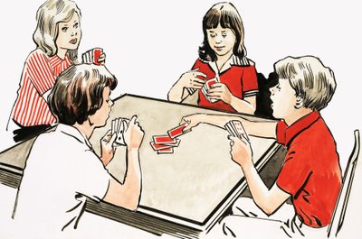 Čtyři děti hrají karty od English School