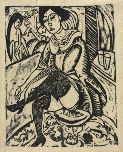 Žena si nazouvá boty od Ernst Ludwig Kirchner