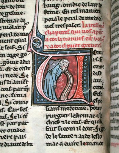 Historická iniciála zobrazující muže zvracejícího (vellum) od French School