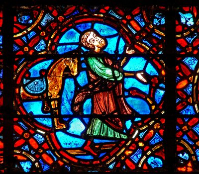 Okno w12 zobrazující scénu v okně Dobrého Samaritána: Samaritán sesedne z koně od French School
