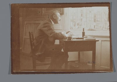 Willem Witsen u psacího stolu ve své lodi od George Hendrik Breitner