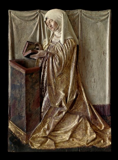 Klečící donátor Fragment vyřezávaného oltářního obrazu z polychromovaného dřeva. Ze Švábska. cca 1520 Paříž, muzeum Louvre od German School