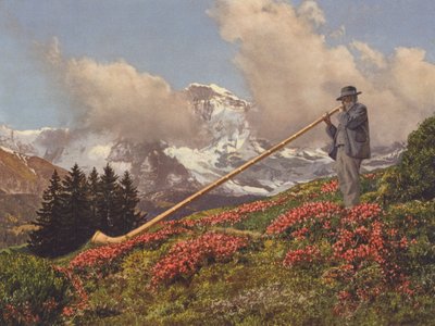 Švýcarsko: Alphorn Blower, Jungfrau v pozadí (barevné foto) od Jean Gaberell