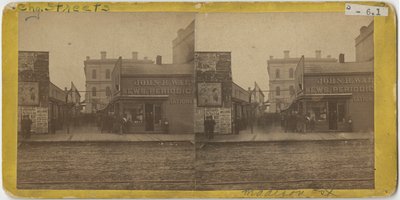 Pohled na obchod John R. Walsh Periodicals na Madison Street, Chicago s poštou v pozadí, 1869 od John Carbutt
