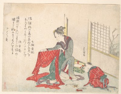 Žena skládající látku od Katsushika Hokusai