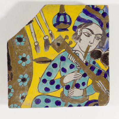 Keramická deska Safavid Persie cuerda seca z konce 17. století zobrazující muže hrajícího na flétnu v turbanu od Persian School