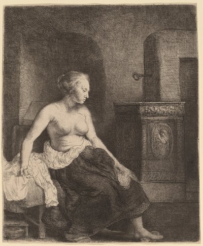 Žena sedí napůl oblečená vedle sporáku od Rembrandt van Rijn