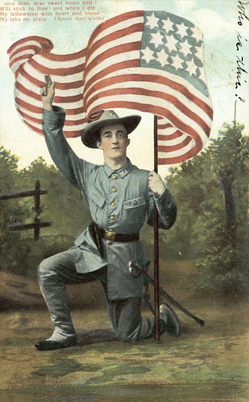 Americký voják držící hvězdy a pruhy (barevné foto) od American School