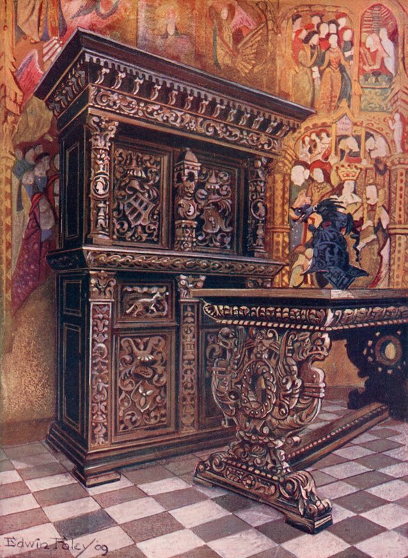 Vyřezávaná dubová armoire, nesoucí šifru Lamberta Suavia z Lutychu. Vyřezávaný dubový stůl od Edwin John Foley