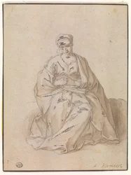 Maria sedí s knihou