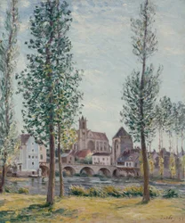 Pohled na Moret sur Loing skrz stromy