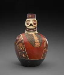 Figurální láhev s posmrtnou maskou, 600-1000 n. l. (hliněné nádobí se skluzem)