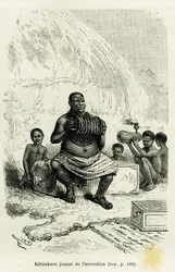 Kmenový vůdce Ketimkuru hraje na akordeon. Rytina Rioua k ilustraci vyprávění „Jezera rovníkové Afriky“ od Victora Girauda, námořního praporčíka, z let 1883-1885, v Le Tour du monde, 1886, pod vedením Édouarda Chartona (1807-1890), Hachette