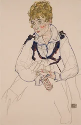 Umělcova žena sedí