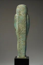 Zadní pohled na figurku Ushabti pro Hor-Khebi, pozdní dynastické období, konec 25.-začátek 26. dynastie, cca 700-600 př.nl (fajáns) (přední strana viz 270353)