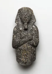Ushabti postava Amenophis IV (Achnaton) (asi 1364-1347 př.nl) z El Amarna, Nová říše (žula)