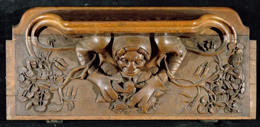 Misericord zobrazující zlobra s obrovskými rameny, New College Chapel, Oxford, konec 14. století (dřevo)