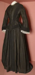 Černý živůtek Florence Nightingaleové a odpovídající sukně, kolem roku 1870