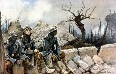 3 francouzští vojáci sedící před ruinami kostela v Dampierre. Válka 1914 - 1918. Paříž, Musée de l