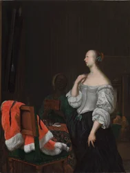 Žena stojící před zrcadlem