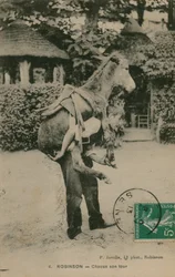 Robinson, turné Chacun don. Mladý muž nesoucí osla