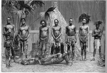 Skupina mužů angolské družiny vystavená v Paříži během světové výstavy v roce 1889 (Lidská zoo).