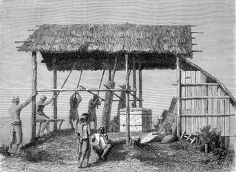 Ilustrace publikovaná ve vydání „Le Tour du monde“ z roku 1862 zobrazující kováře v dayacích na ostrově Borneo. Rytina.
