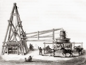 Dělníci používající kolotoč a naviják k vrtání artézských studní v Grenelle ve Francii v 19. století z „Les Merveilles de la Science“, vydaného kolem roku 1870 (rytina)