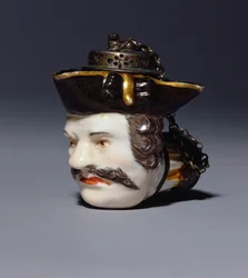 Míšeňská portrétní dýmka modelovaná jako hlava Schmiedela, kolem roku 1750 (porcelán)
