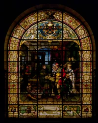 William Caxton ukazuje svou první tištěnou knihu Edwardu IV. a jeho manželce Elizabeth Woodville v roce 1477, od Mayer and Co., mnichovská firma působící v Londýně, kolem roku 1880 (okno z barevného skla)