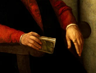 Předpokládaný portrét Francoise Rabelaise (1494-1553), francouzského spisovatele a lékaře. Detail knihy, kterou drží v ruce, a rytíře, kterého nosí na prstě. Obraz Giovanni Battista Moroni (1525-1578)