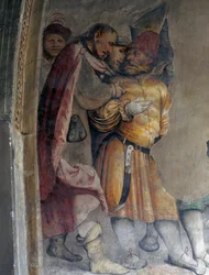 Dva muži spolu mluví, detail fresky od Girolama Romanina (cca 1484-po 1562), levá stěna presbytáře kostela svatého Antonína opata, Breno. Itálie