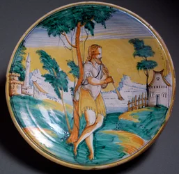 Renesanční umění: talíř zdobený hráčem na flétnu (Hráč na flétnu) - Konec 16. století. Vyrobeno ve Viterbu (Viterbo), Itálie. Florencie, Museo Nazionale del Bargello