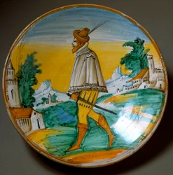 Mladý střelec. Keramický talíř vyrobený ve Viterbu v Itálii. Konec 16. století. Florencie, Museo Nazionale del Bargello