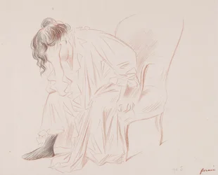 Žena sedí.
