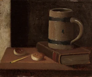 Hrnek, kniha, sušenky a zápas