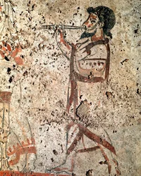 Hudebník hrající na flétnu. Lukánská freska ze 4. století př. n. l., z nekropole v Paestu, Itálie. Museo Nazionale Archeologico, Paestum