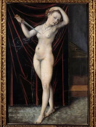 Lucretia si bere život. Sebevražda Lucretie, římské dámy z 6. století př. n. l. Obraz Lucase Cranacha (1472-1553), 16. století. Besançon, Muzeum výtvarných umění