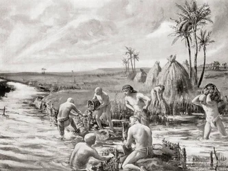 První osadníci v Babylónii vysušují bažiny stavbou hráze, z Hutchinsonovy Historie národů, vyd. 1915.
