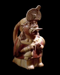 Předkolumbovské umění, kultura Moche (Moche, Mochica): antropomorfní váza znázorňující kněze obětujícího dvě zvířata. 200 př. n. l.-700 n. l. Lima, Národní muzeum antropologie a archeologie