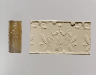 Válcová pečeť a moderní dojem: mužská postava dominující okřídleným lvům s lidskou hlavou, c. 8.–7. století př. n. l. (chalcedon)