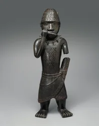 Figurka Hornblowera, Nigérie, cca 1504-50 (slitina mědi)