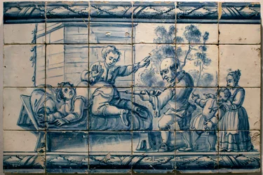 Lékař podávající pacientovi klystýr - Satirický panel z Lisabonu, první polovina 18. století (Lékař - Satirický panel, první polovina 18. století) - Národní muzeum azulejos, Lisabon (Portugalsko)