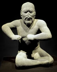 Předkolumbovské umění, olmécká civilizace: „Zápasník“, socha z Veracruzu v Mexiku. Národní antropologické muzeum, Ciudad de México, Mexiko